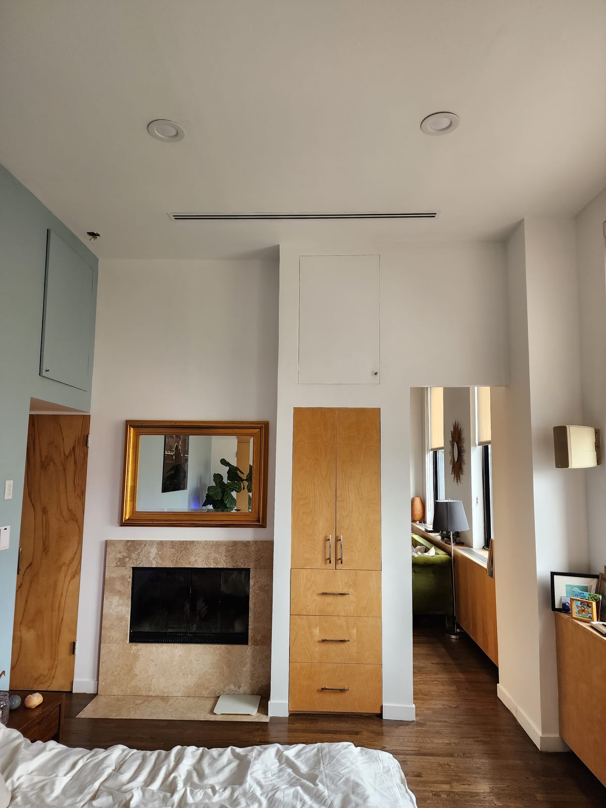 Room interior showing finished HVAC with linear diffuser and concealed ductwork