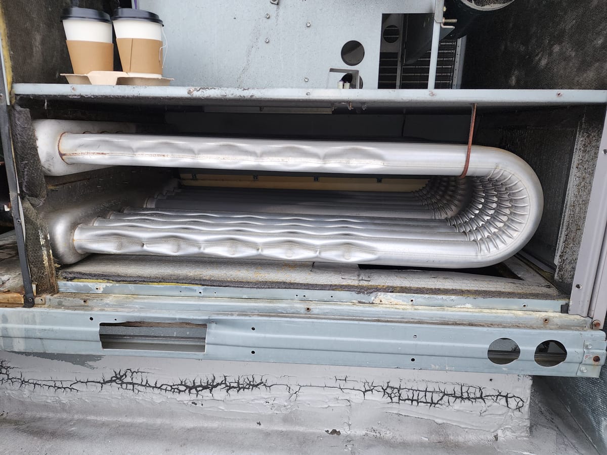 Furnace blower motor and housing removed for replacement