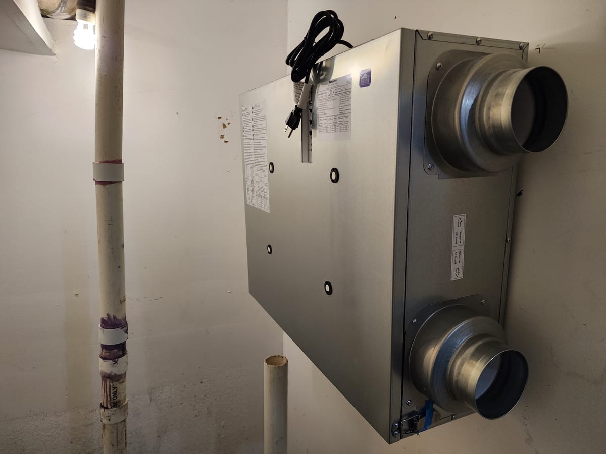 Panasonic ERV unit wall mounted with four round duct ports