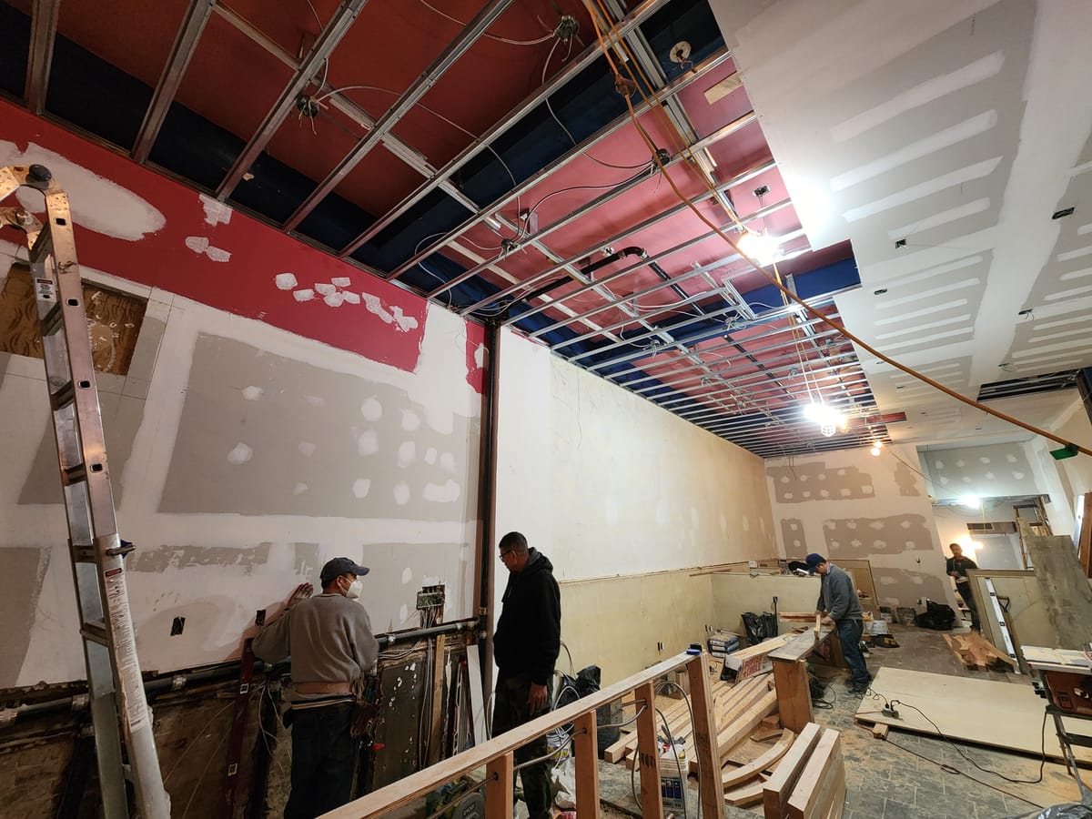 Commercial space gutted for HVAC renovation with exposed framing