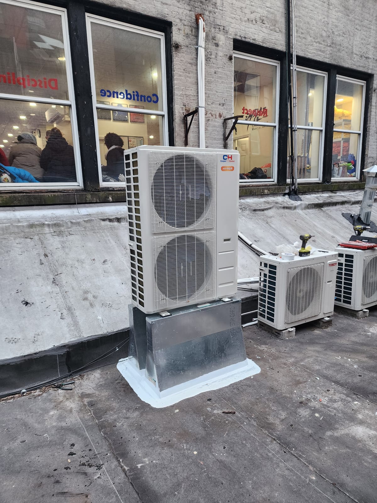 Restaurant interior during renovation with ceiling cassette visible