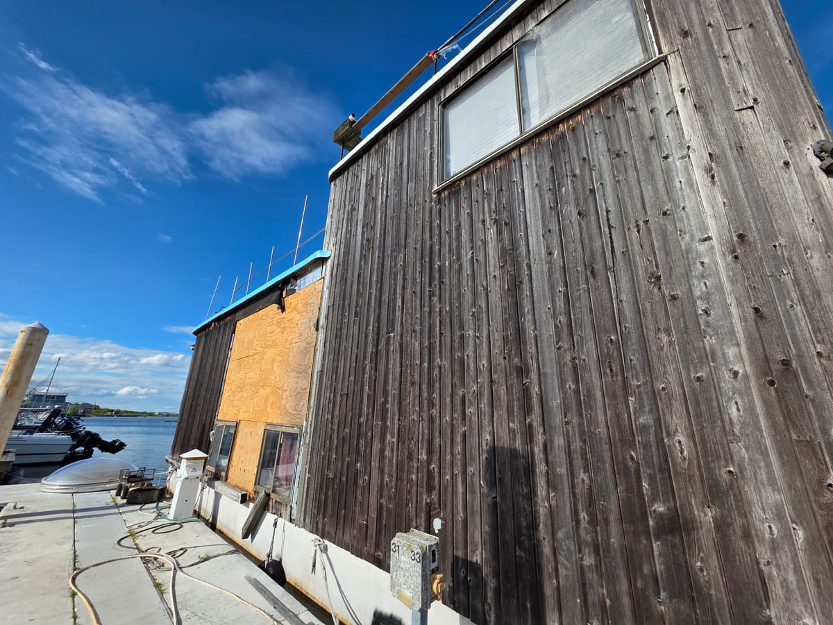 Marina boathouse building exterior with HVAC line runs