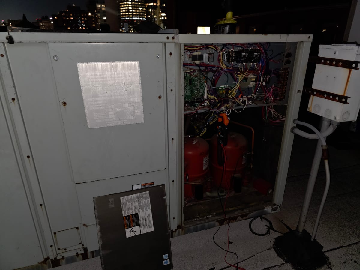 RTU rooftop unit open for night emergency repair