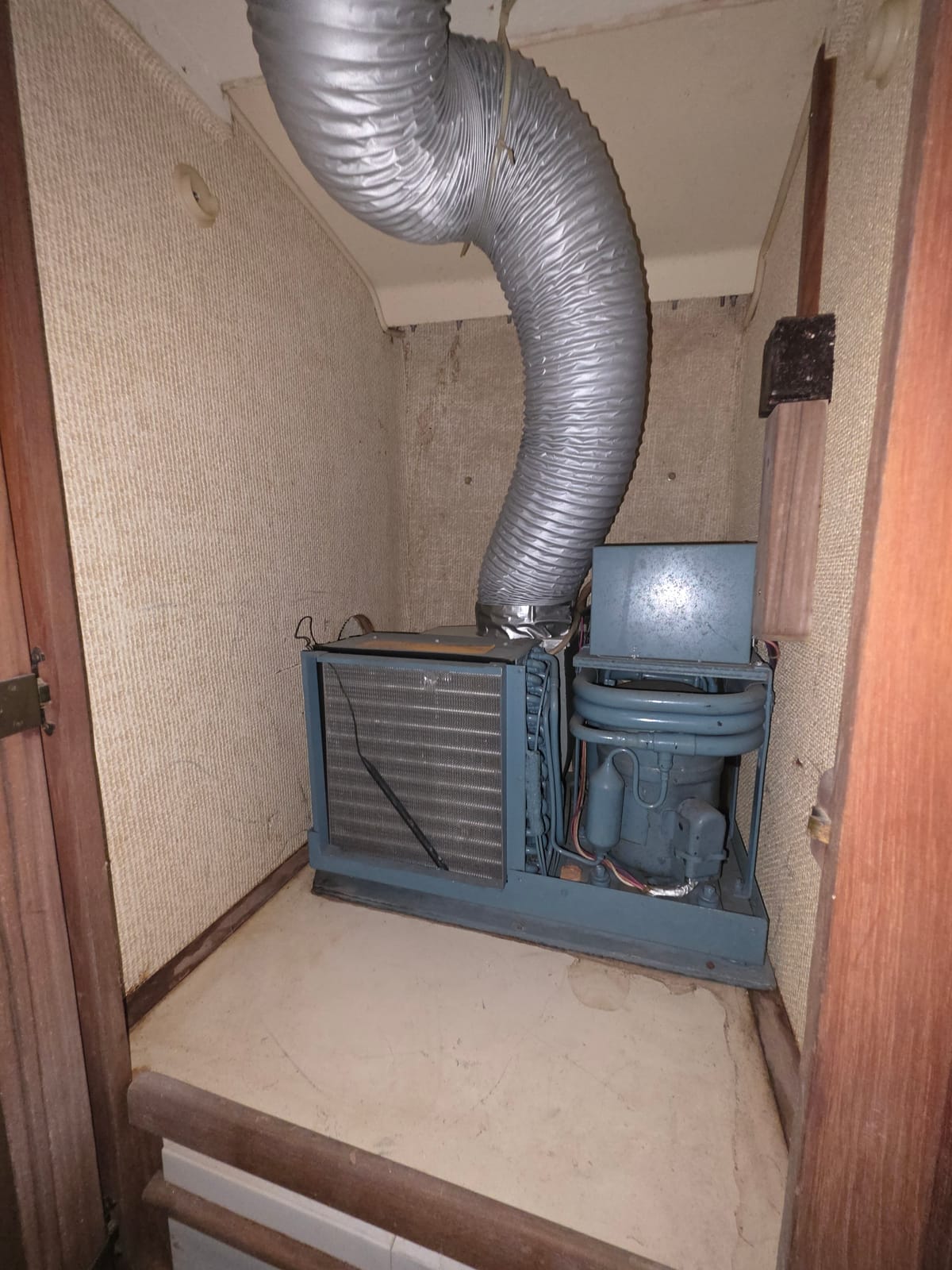 VRF outdoor unit with open panel showing PCB and refrigerant lines